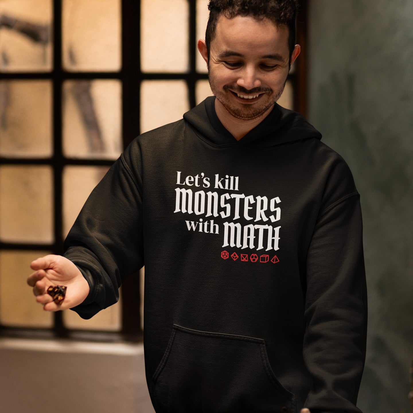 Man Wearing Let's Kill Monsters with Math Hoodie at the game table